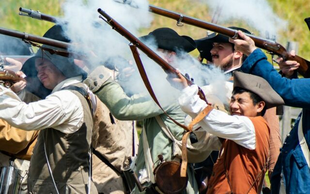 Mechanization of Humans a group of men in uniform holding guns